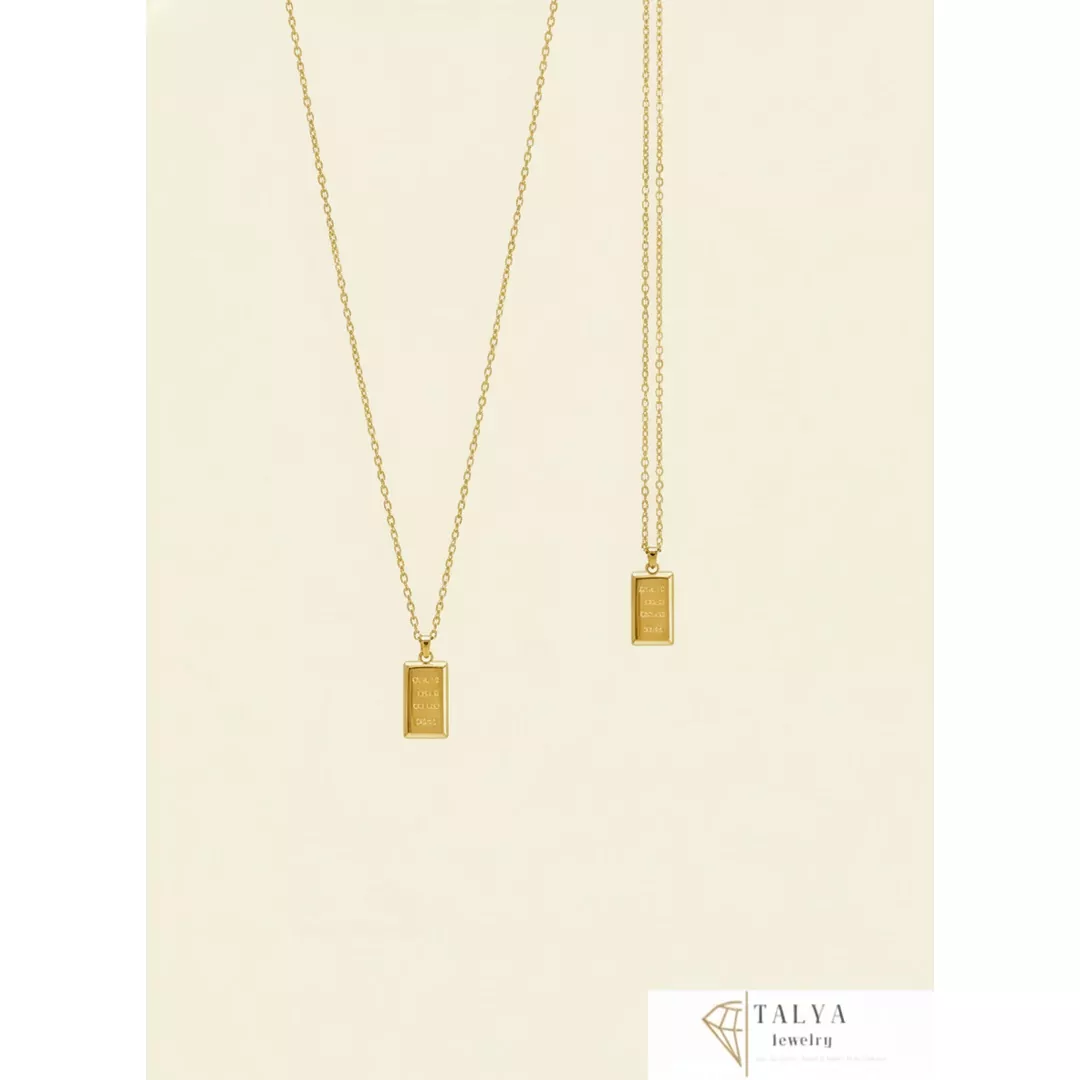 cadre_1080_Gemini_Generated_Image_lny4e3lny4e3lny4 Collier et bracelet de 18 en forme de barre d'or - Image 1